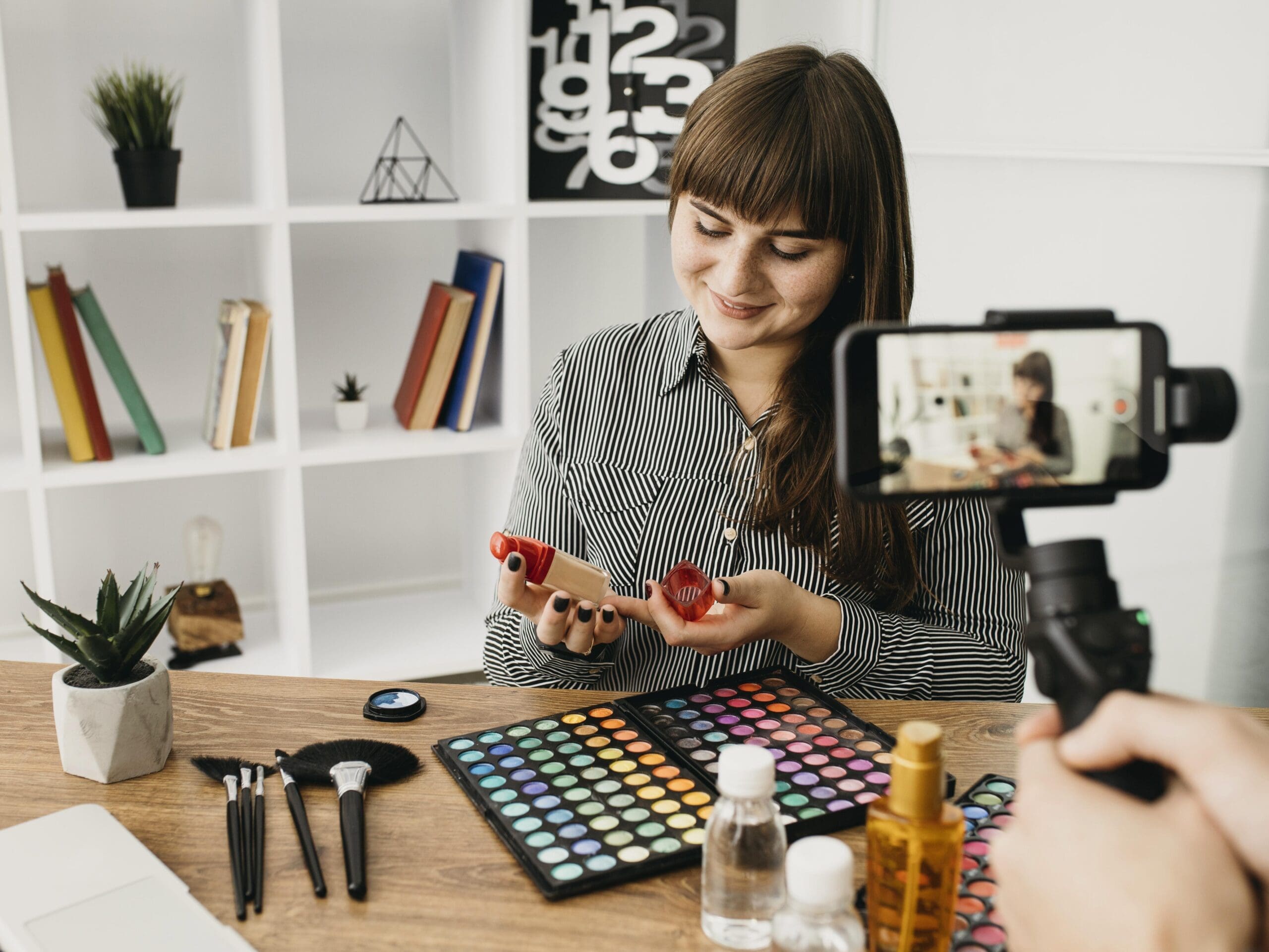 female-make-up-blogger-with-streaming-with-smartphone-home Use TikTok to Fuel Your Content Engine