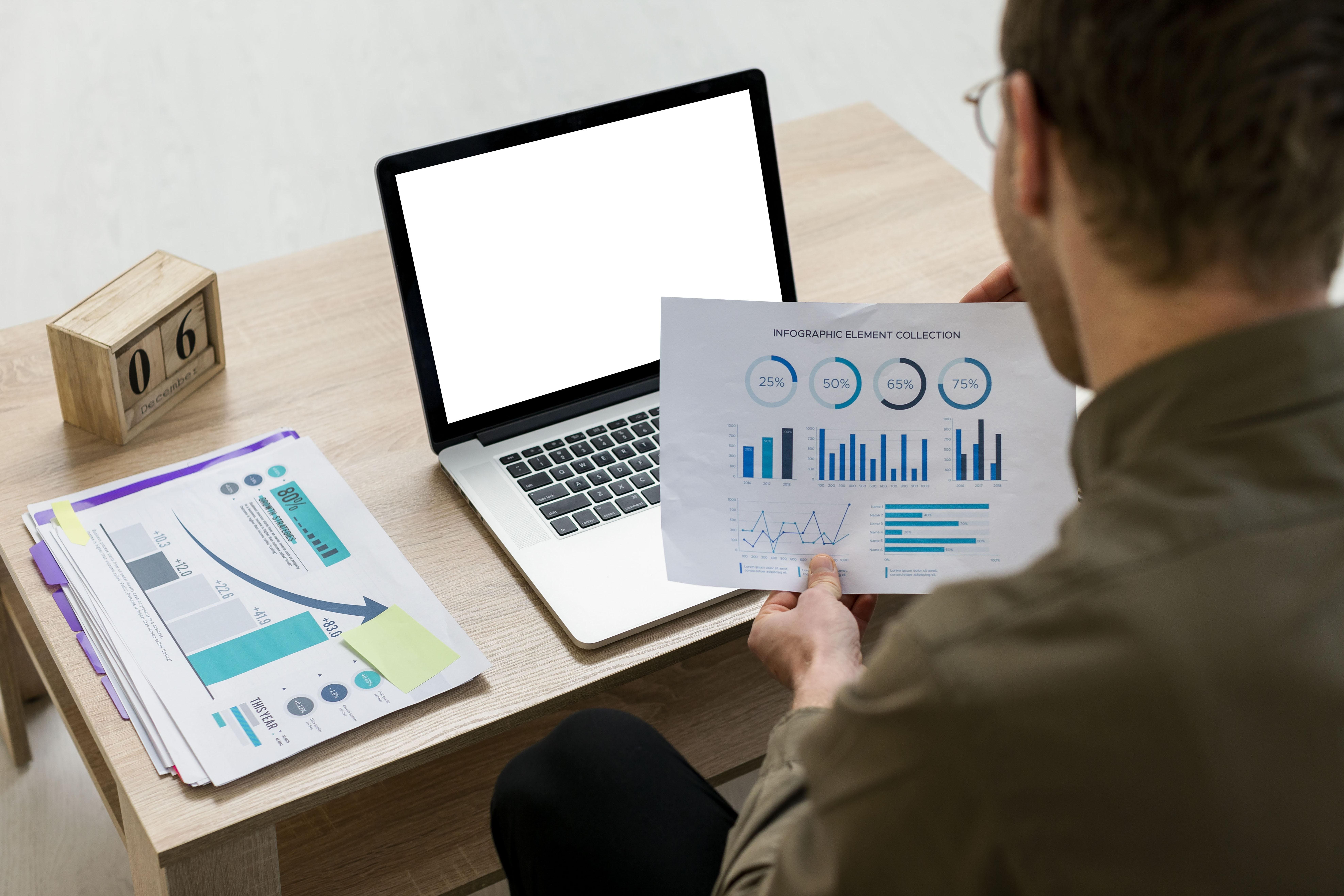 man-working-with-infographics-indoors Track Metrics & Use Data to Scale Smartly