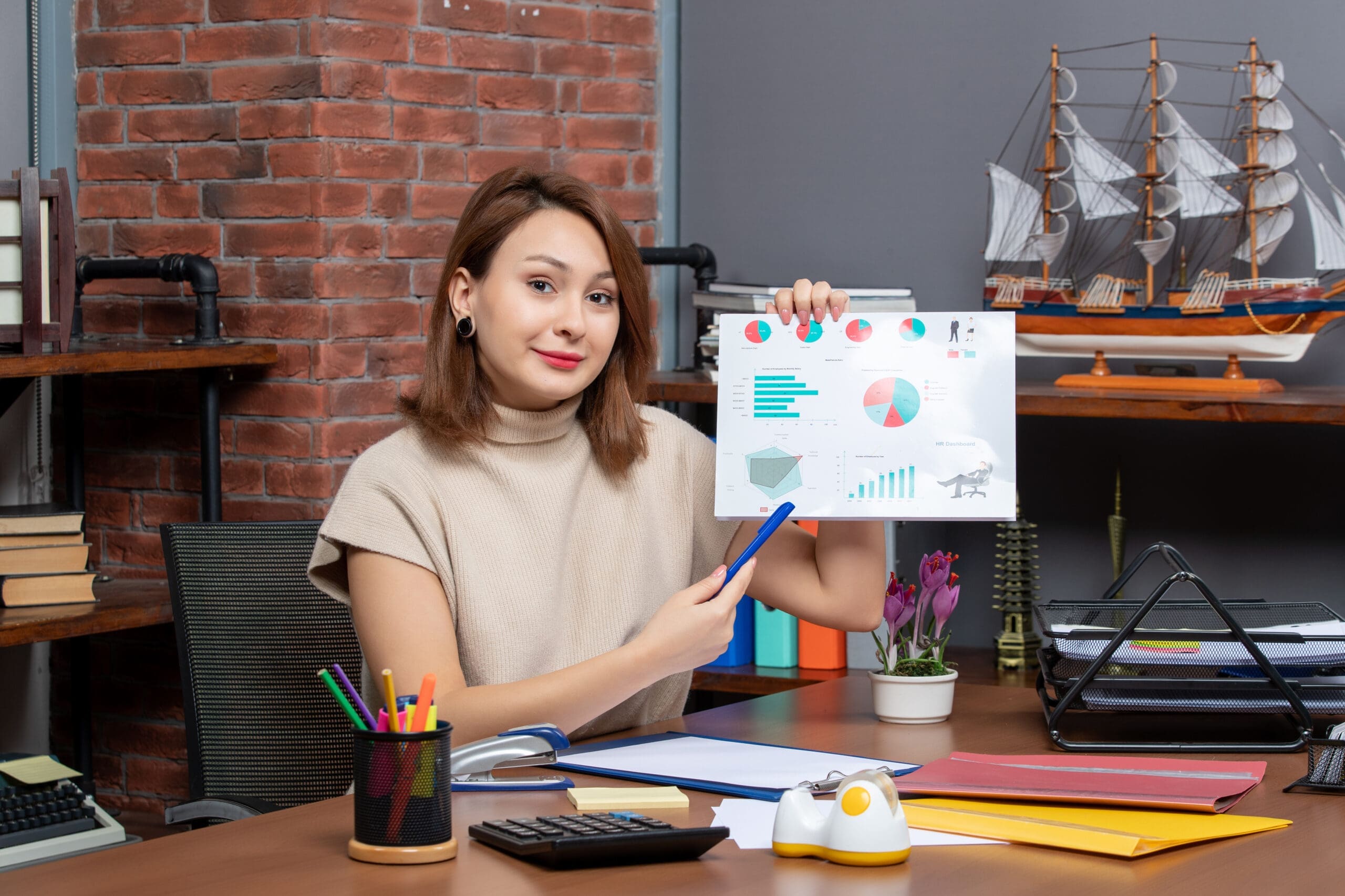 front-view-pretty-woman-showing-diagrams-working-office Bring Your Analytics to Life with Storytelling